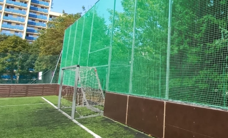 Increasing the fencing behind the goal of the soccer field